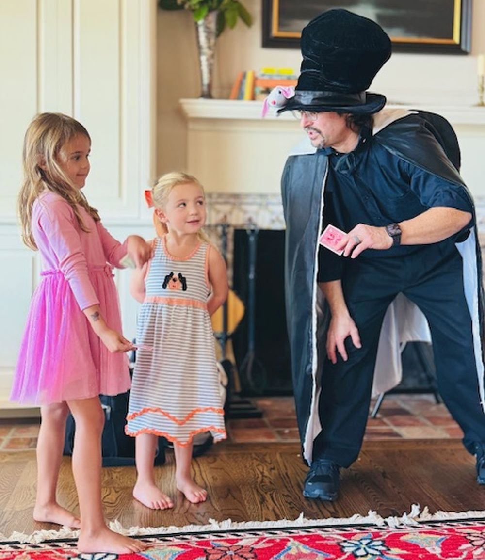 Two assistants helping perform the magic